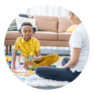 Play Therapy Session with a Woman and Boy